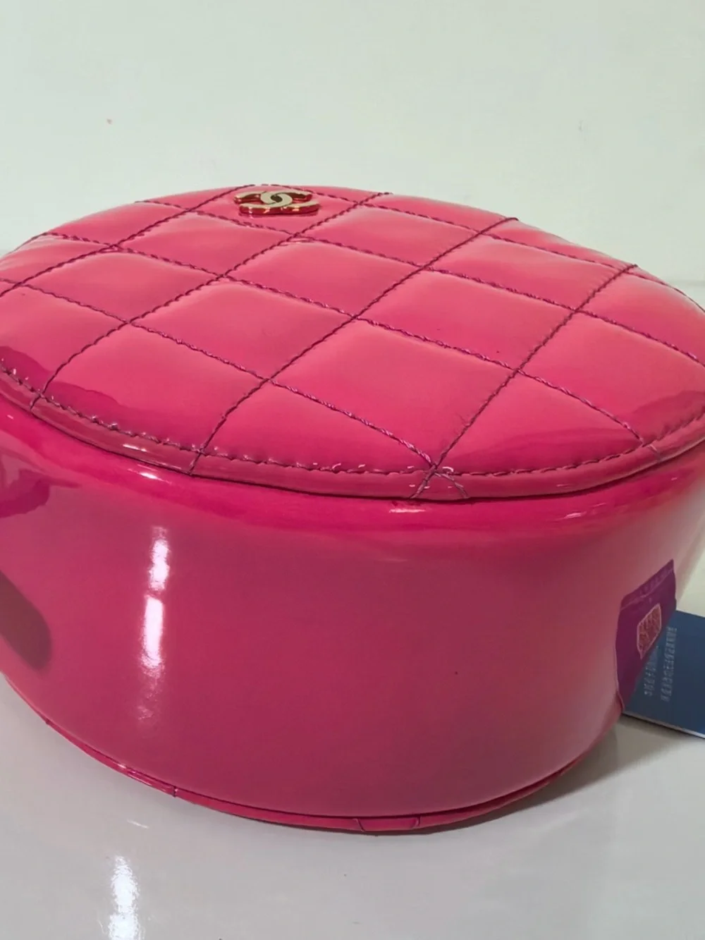 CHANEL Hot Pink Quilted Patent Leather Round Crossbody with Gold CC